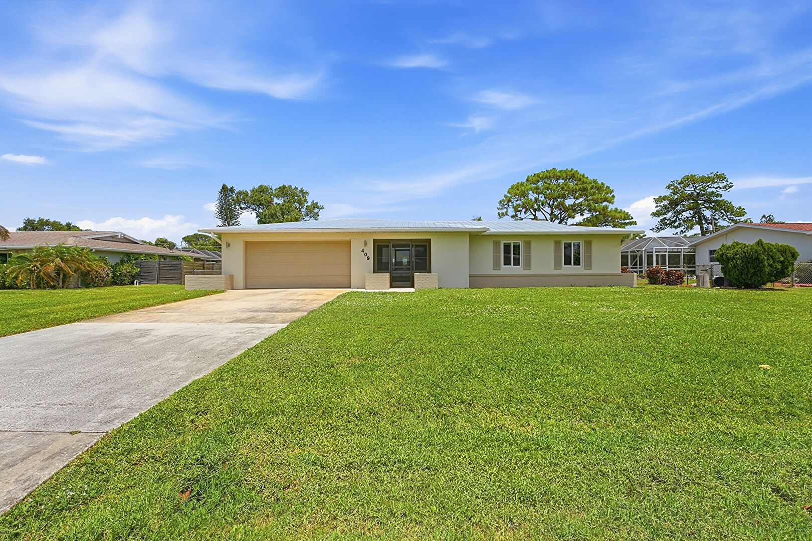 Front at 409 Southeast Gasparilla Avenue, Port St. Lucie, FL 34983, listed by Cameron Post