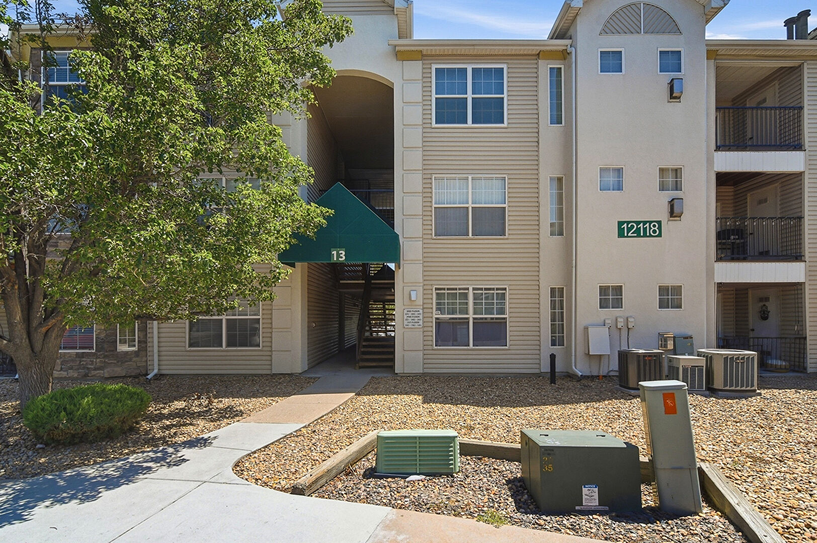 Exterior of building at 12118 West Dorado Place, # 103, Littleton, CO 80127, listed by Luxe Home Group