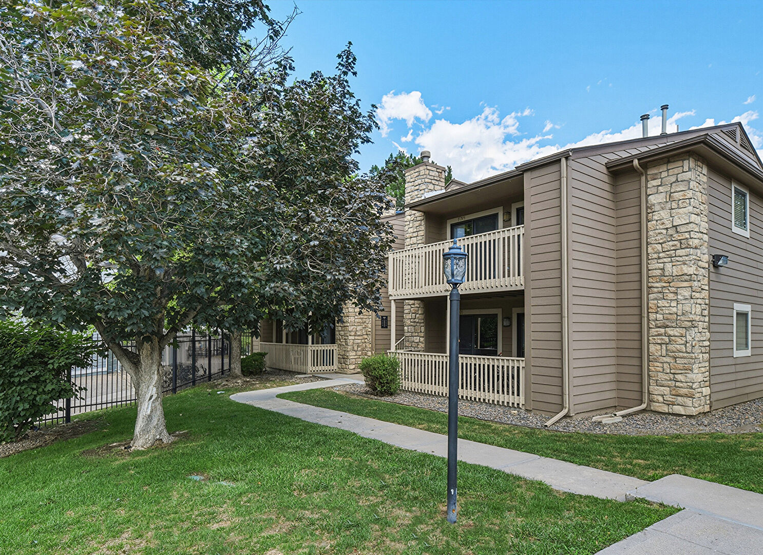Front of Structure at 10293 East Peakview Avenue, Unit F201, Englewood, CO 80111, listed by Helen Bovin