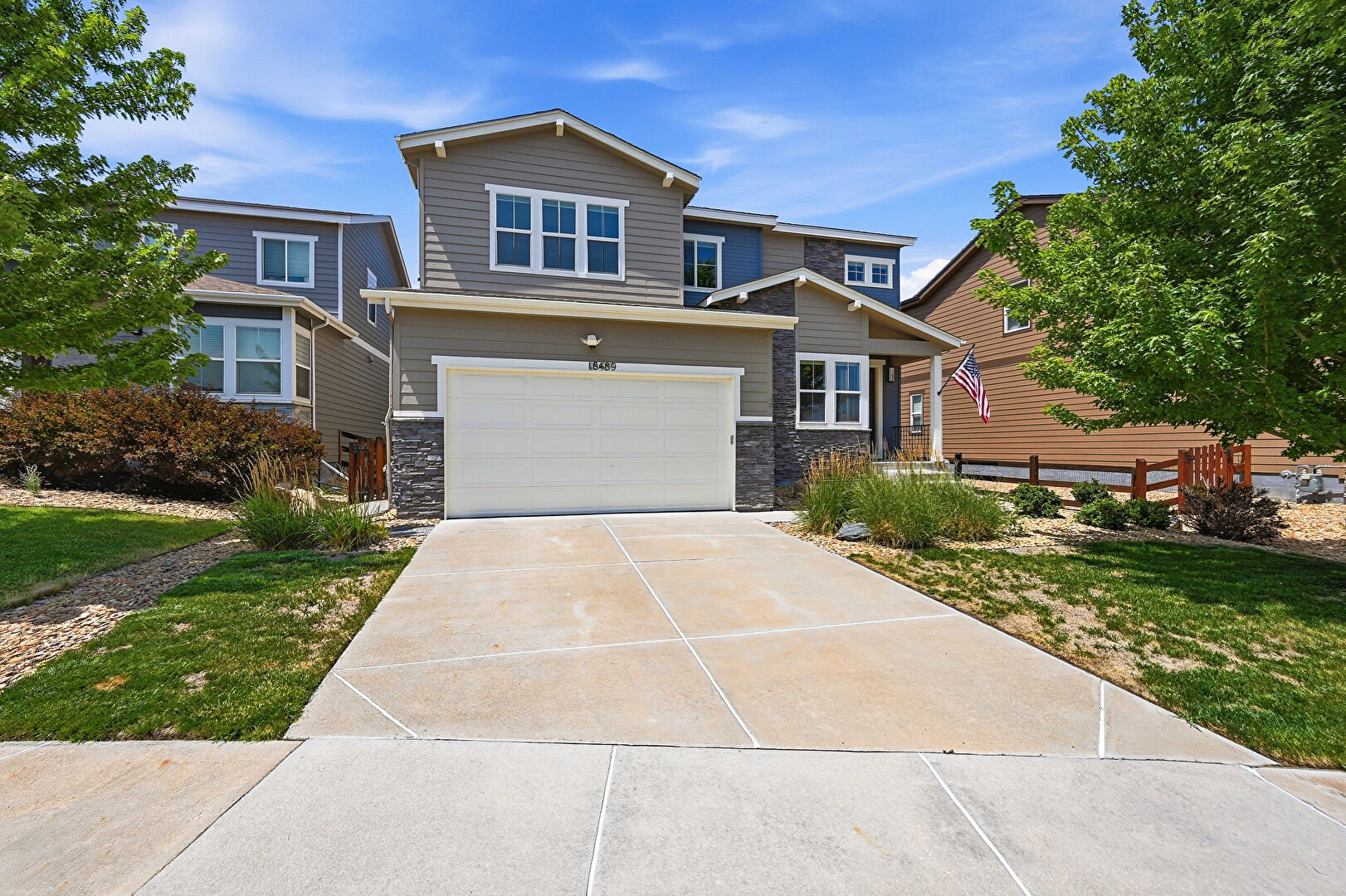 Front at 18489 West 84th Place, Arvada, CO 80007, listed by Amanda Lam
