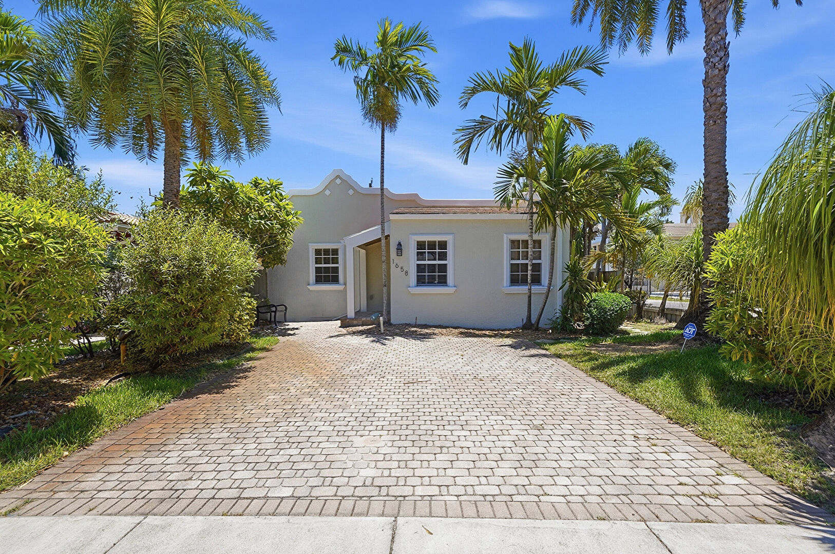 Front at 1658 Jackson Street, Hollywood, FL 33020, listed by Katherine Lizana