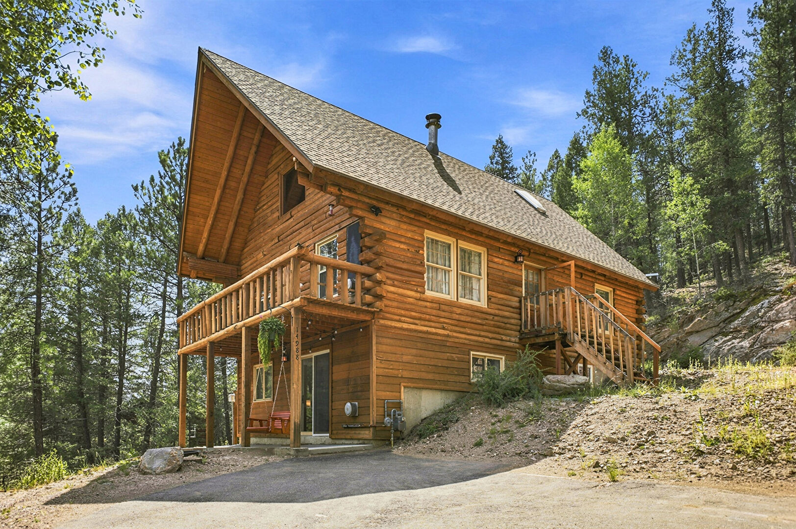 Front at 14988 South Wandcrest Drive, Pine, CO 80470, listed by K.C. Golfinopoulos