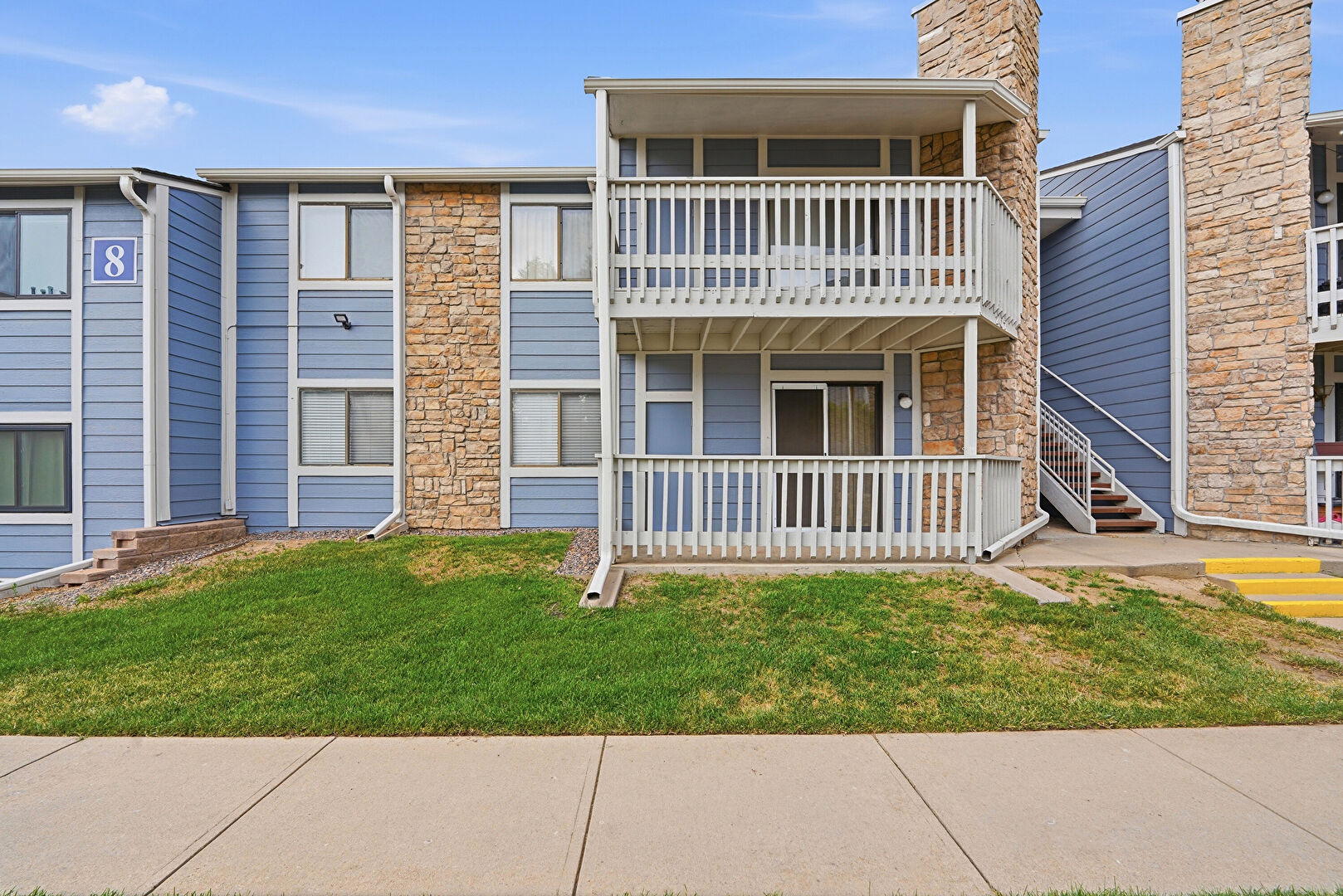 Front at 8335 Fairmount Drive, Unit 107, Denver, CO 80247, listed by Sharon O'Connell