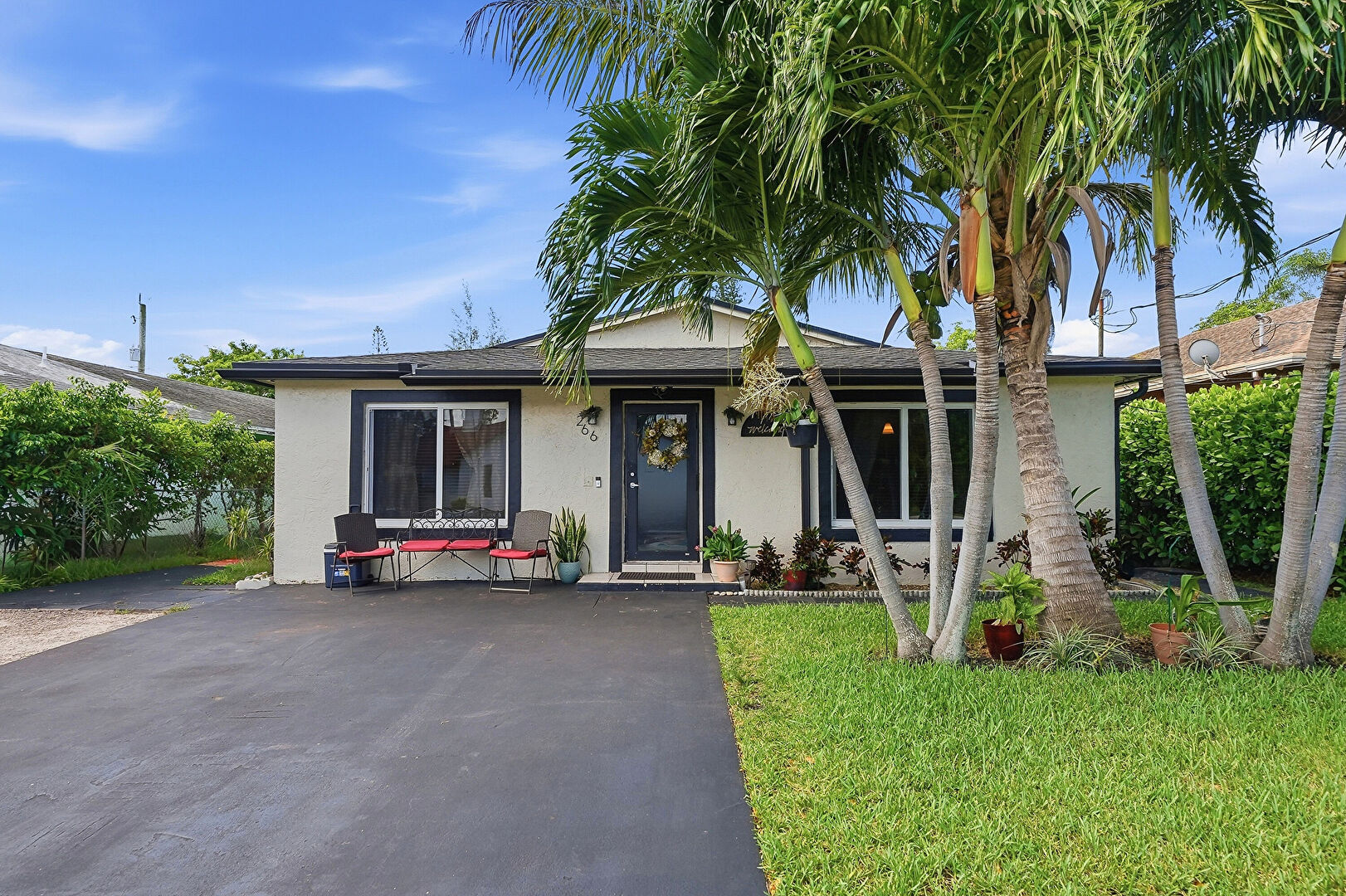 Front at 266 Southwest 7th Court, Deerfield Beach, FL 33441, listed by Ana Garcia