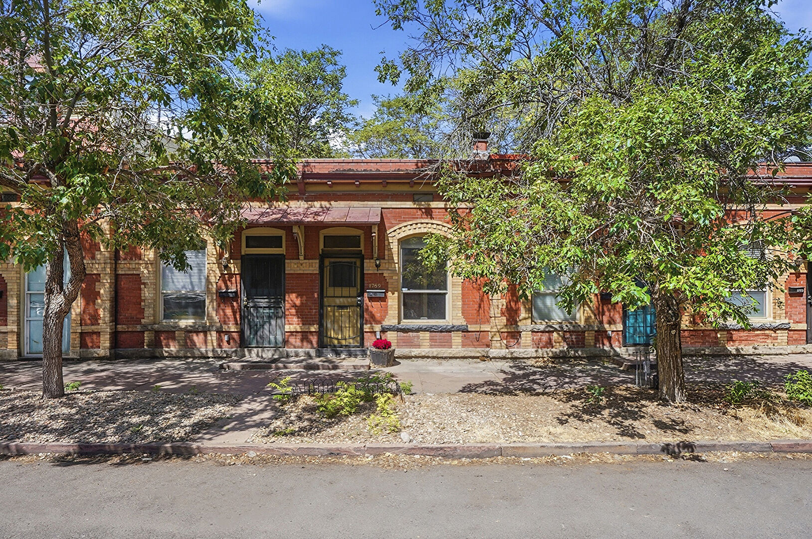 Front at 1769 North Washington Street, Denver, CO 80203, listed by Jenna and Patrick McMenaman