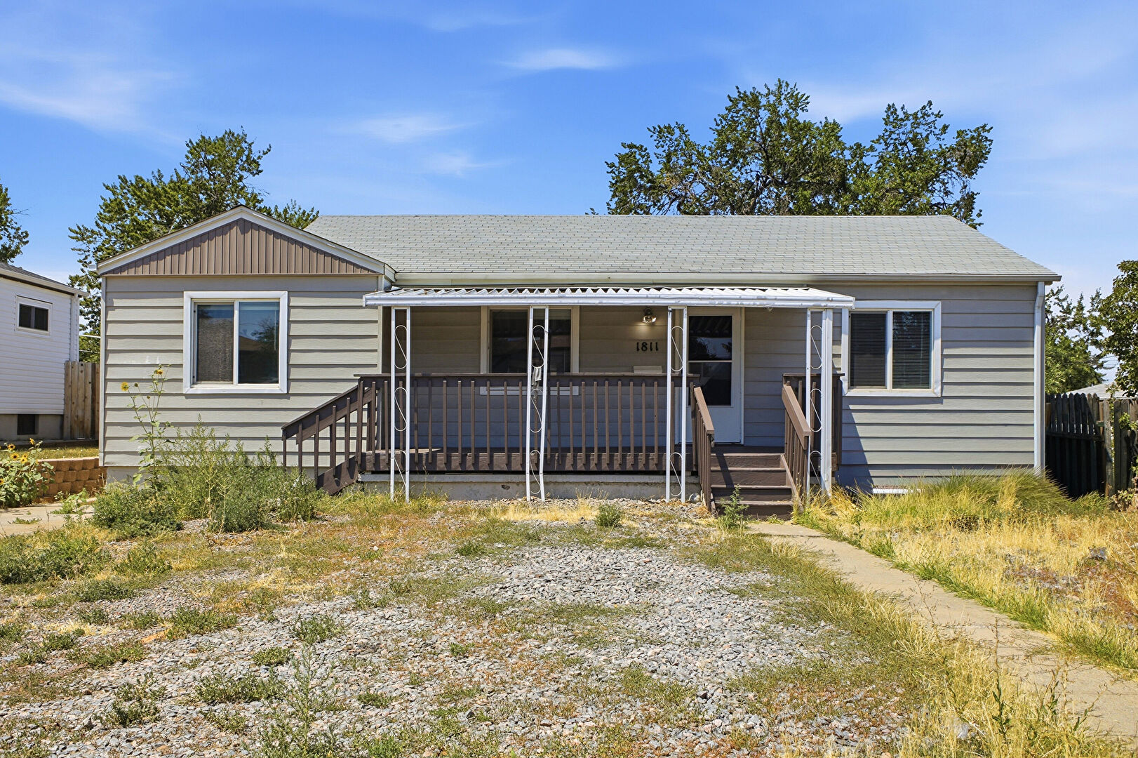 Front at 1811 South Irving Street, Denver, CO 80219, listed by Taylor Haas