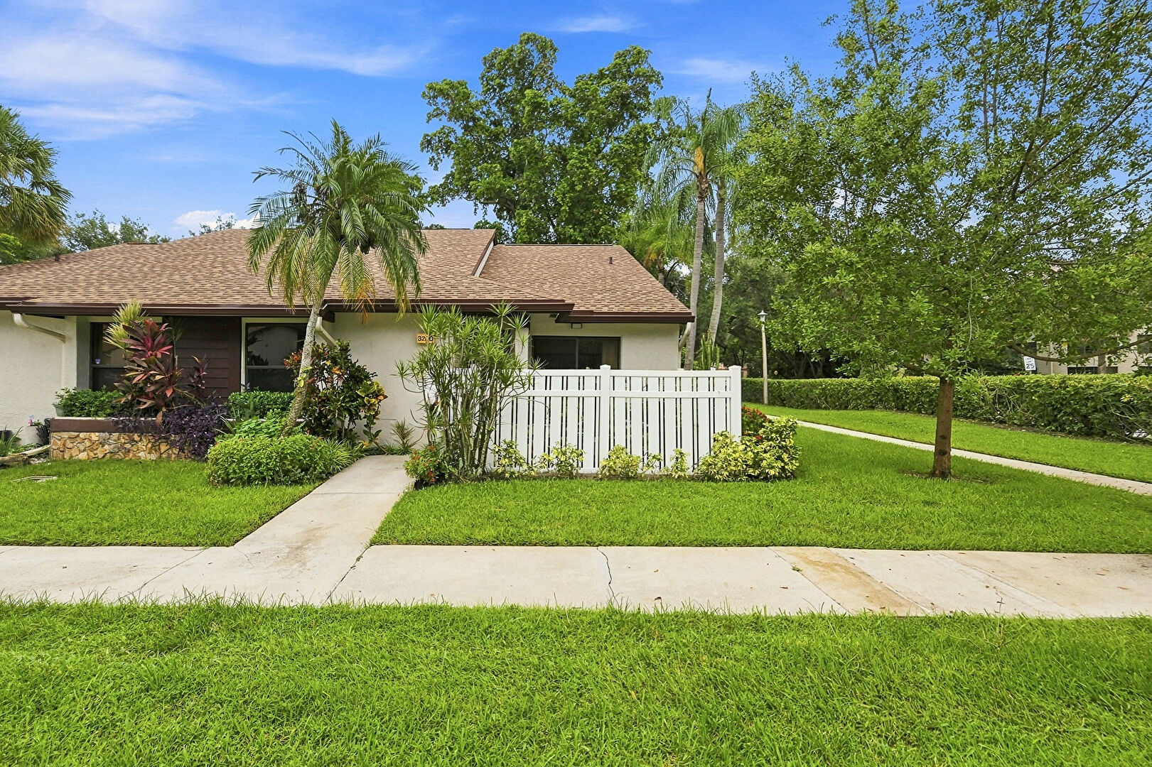 Front at 3200 carambola circle, coconut creek, FL 33066, listed by Laura Sanders