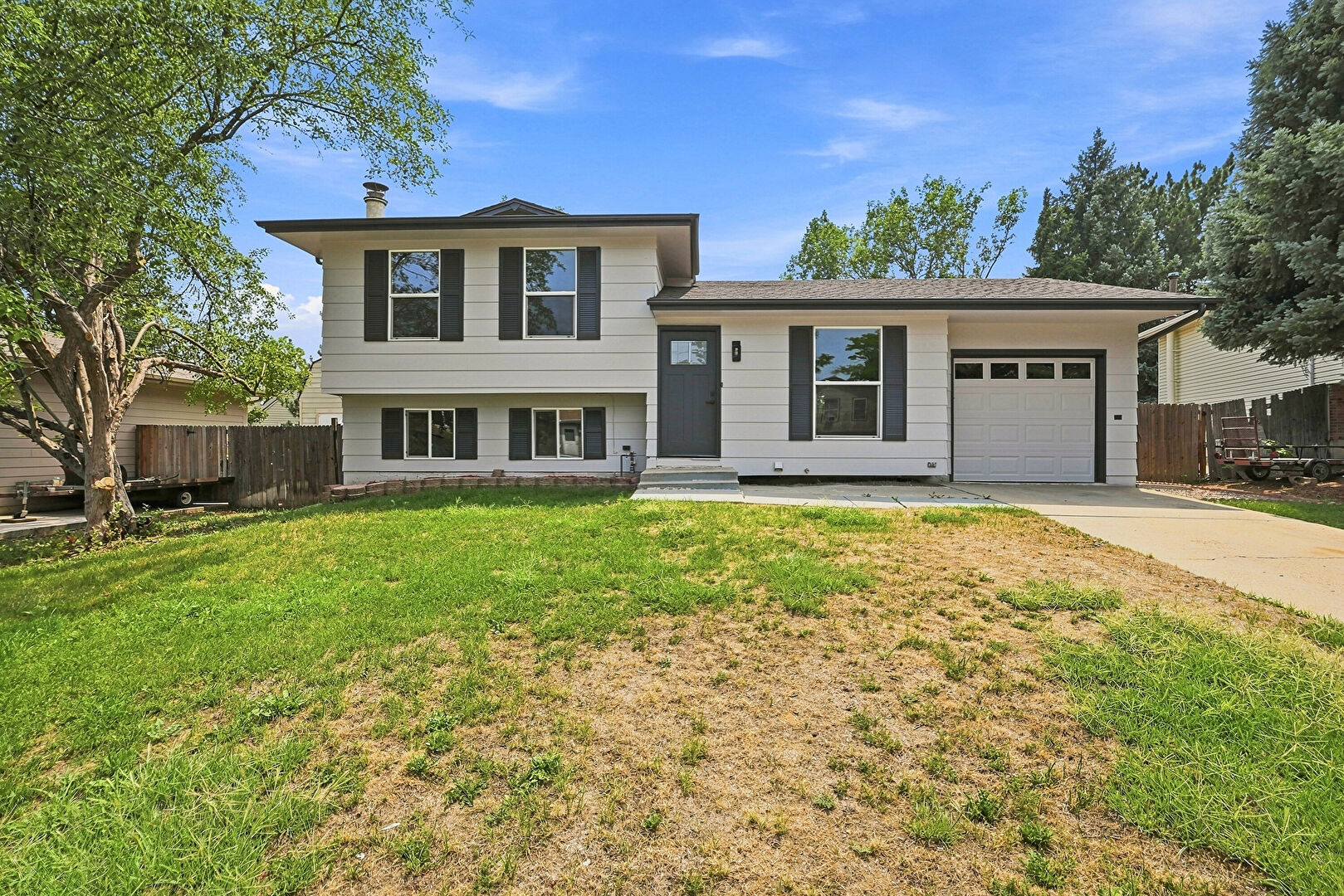 Front at 15340 East Iowa Place, Aurora, CO 80017, listed by Magali Fredrick