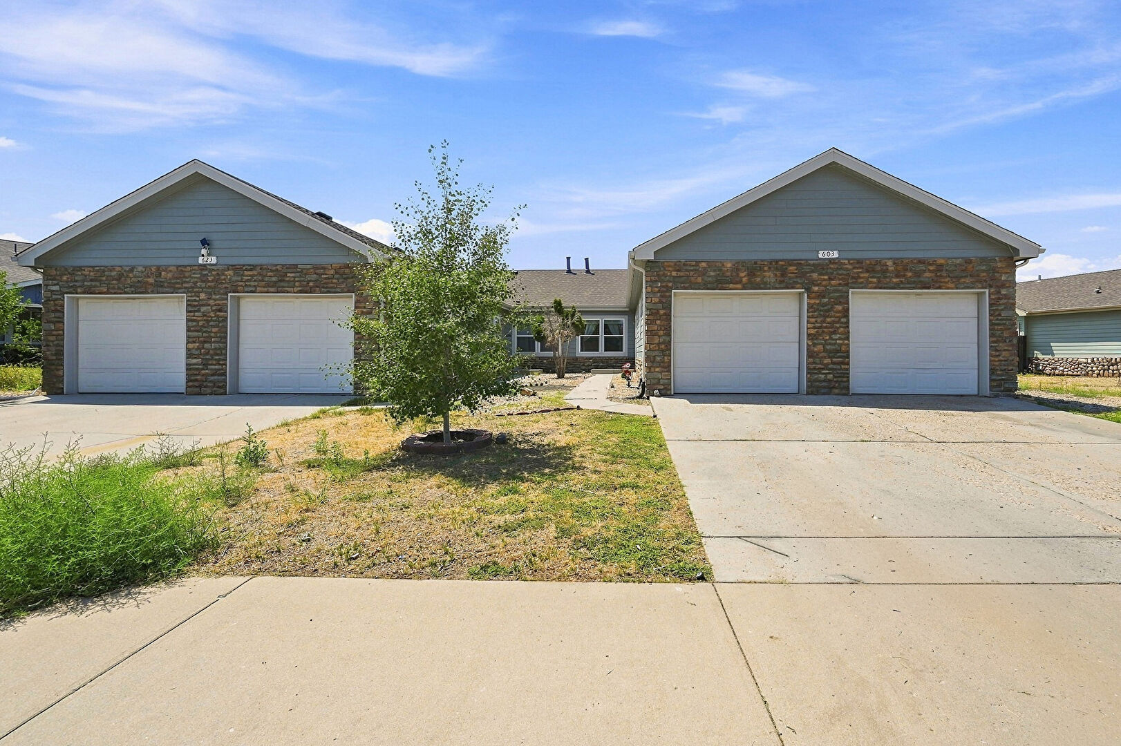 Front at 603 S Carriage Drive, Milliken, CO 80543, listed by Rondi DuPont