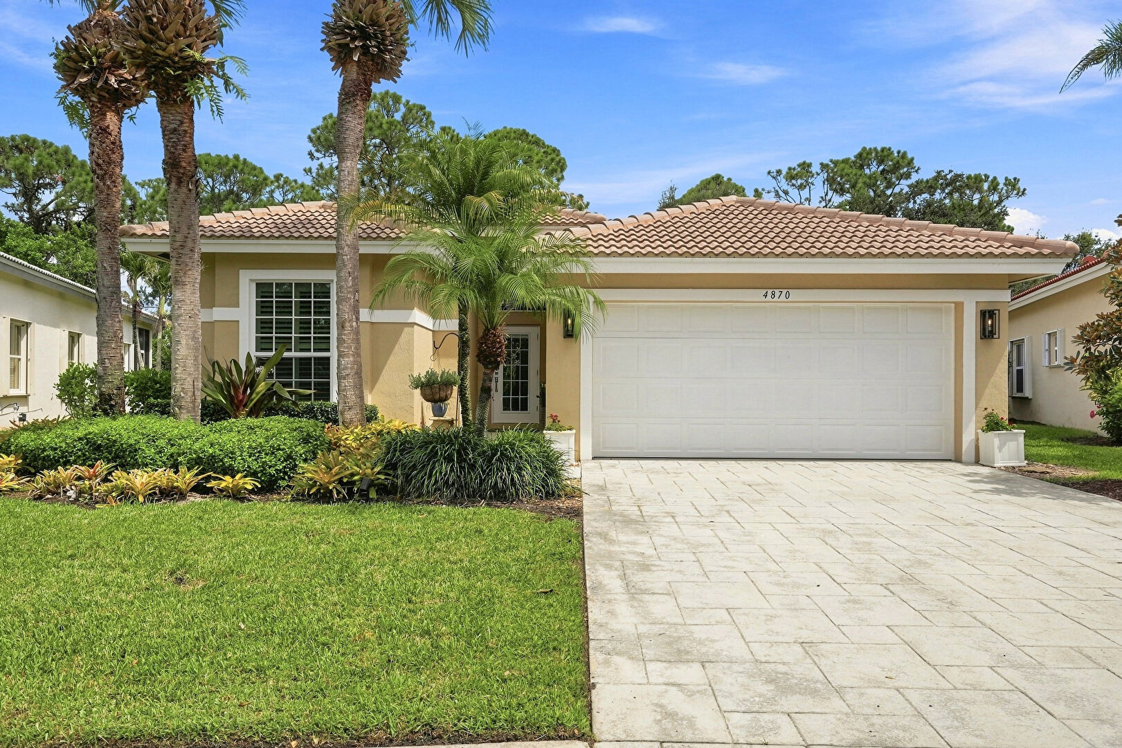 Front at 4870 Southeast Devenwood Way, Stuart, FL 34997, listed by Karen Griffin