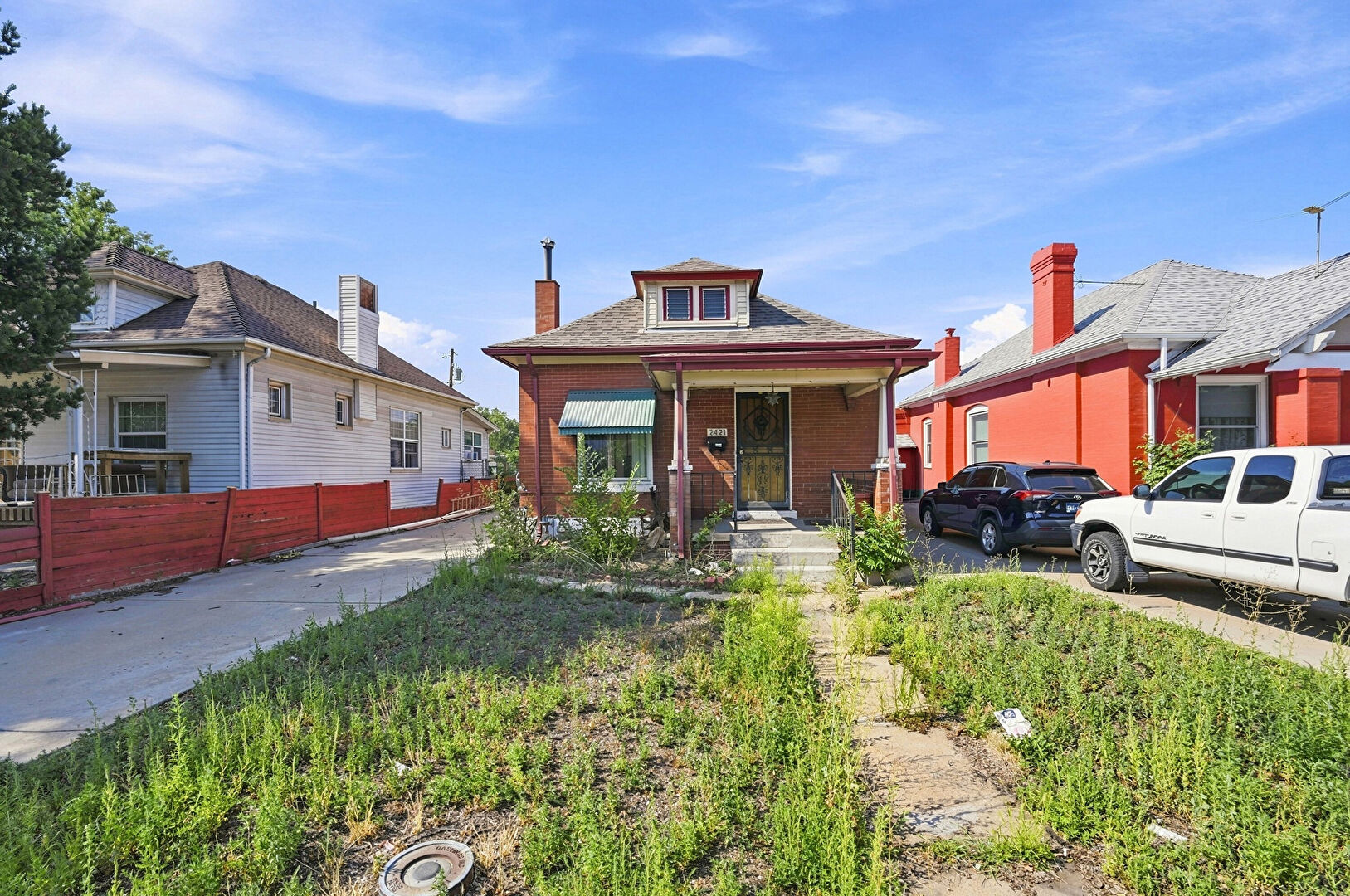 Front at 2421 West 38th Avenue, Denver, CO 80211, listed by Andria and Eric Stashak