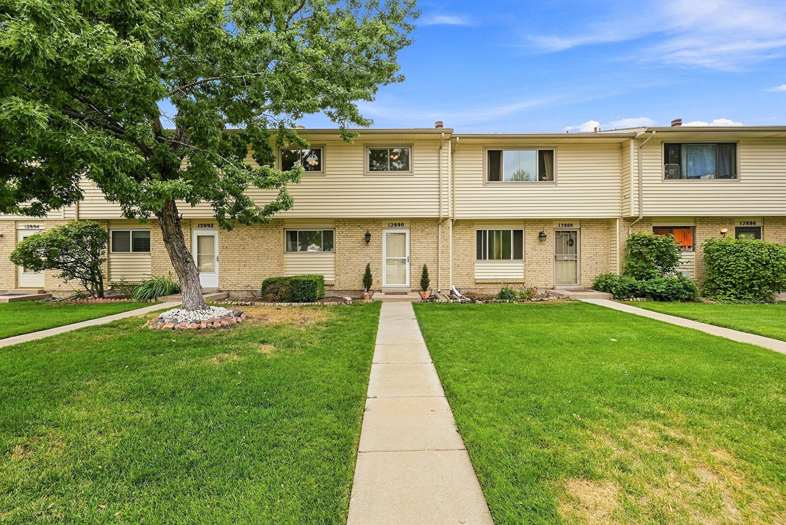 Front at 12890 East Kansas Place, Aurora, CO 80012, listed by Richard Stang