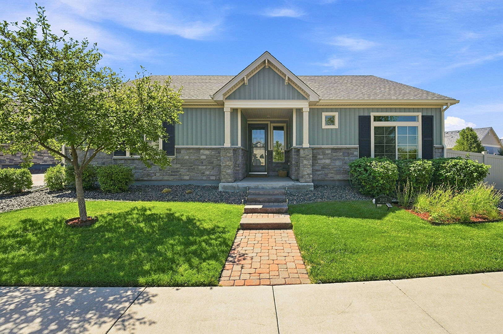 Front at 20412 East 52nd Avenue, Denver, CO 80249, listed by Kristen White