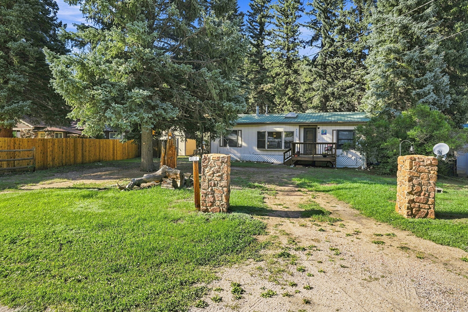 Front at 5099 County Road 64, Bailey, CO 80421, listed by Jacqueline Neal