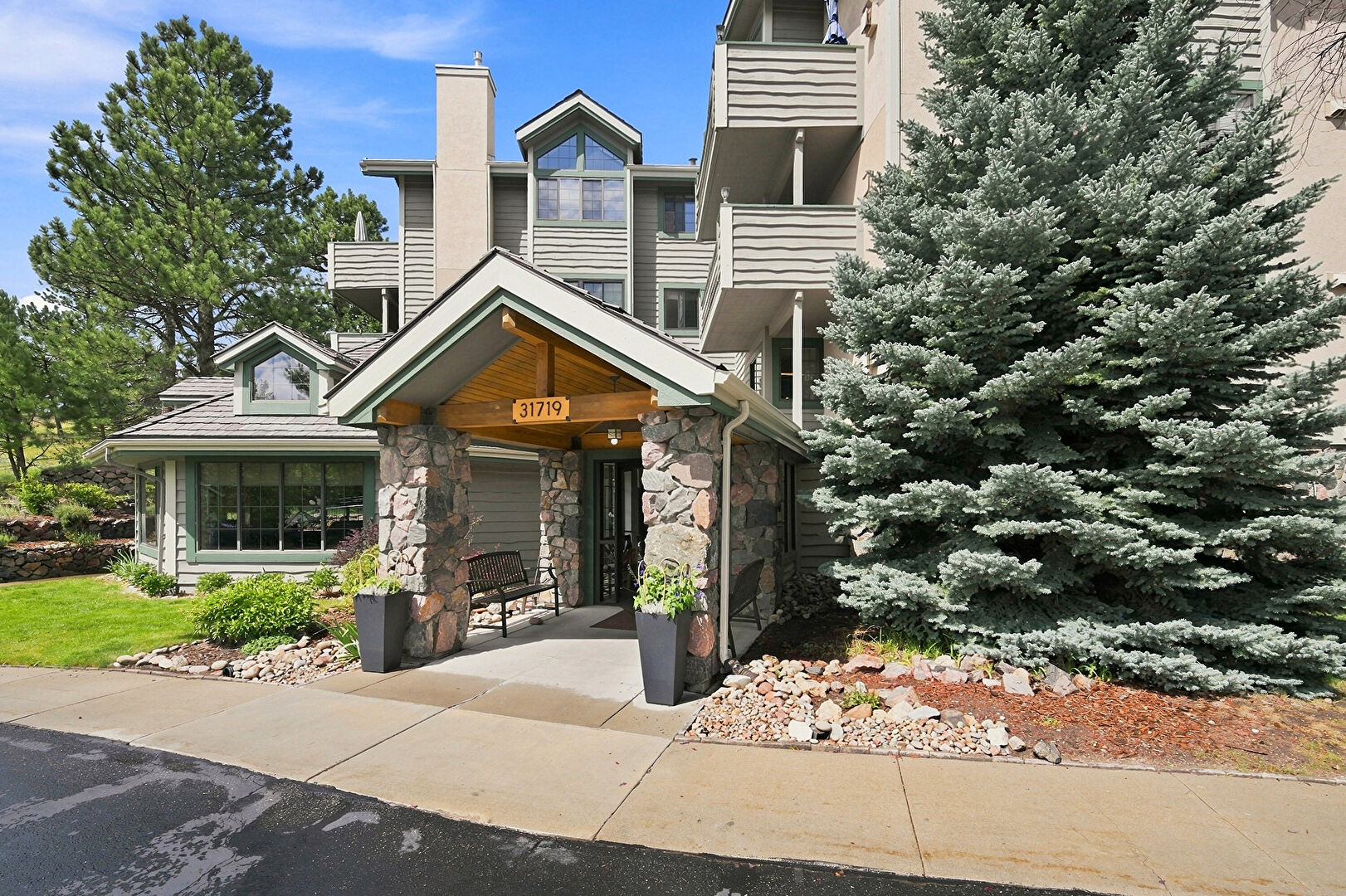 Front at 31719 Rocky Village Drive, Unit 103, Evergreen, CO 80439, listed by Jenna and Patrick McMenaman
