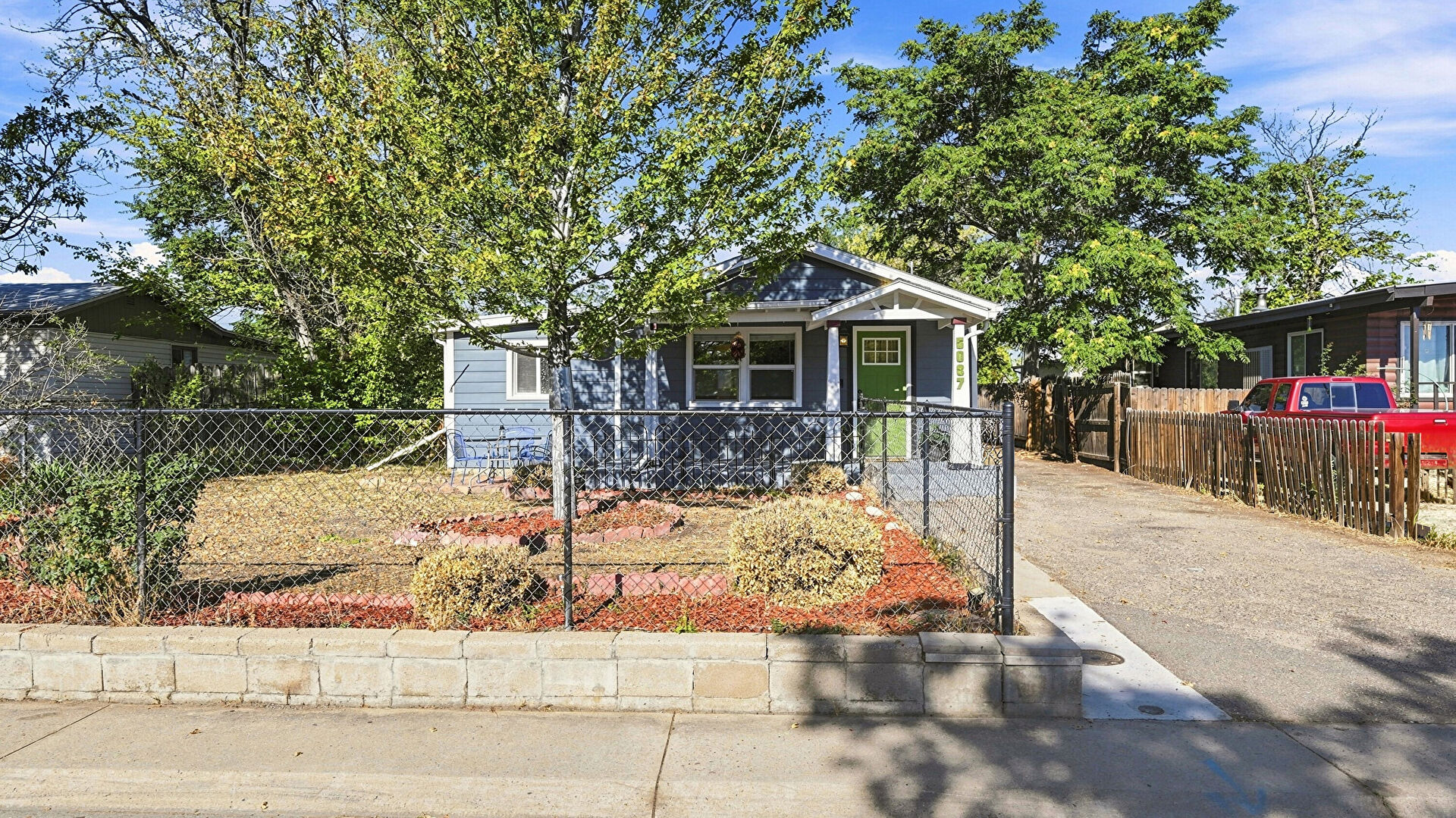 Front at 5037 Saint Paul Street, Denver, CO 80216, listed by William Martin