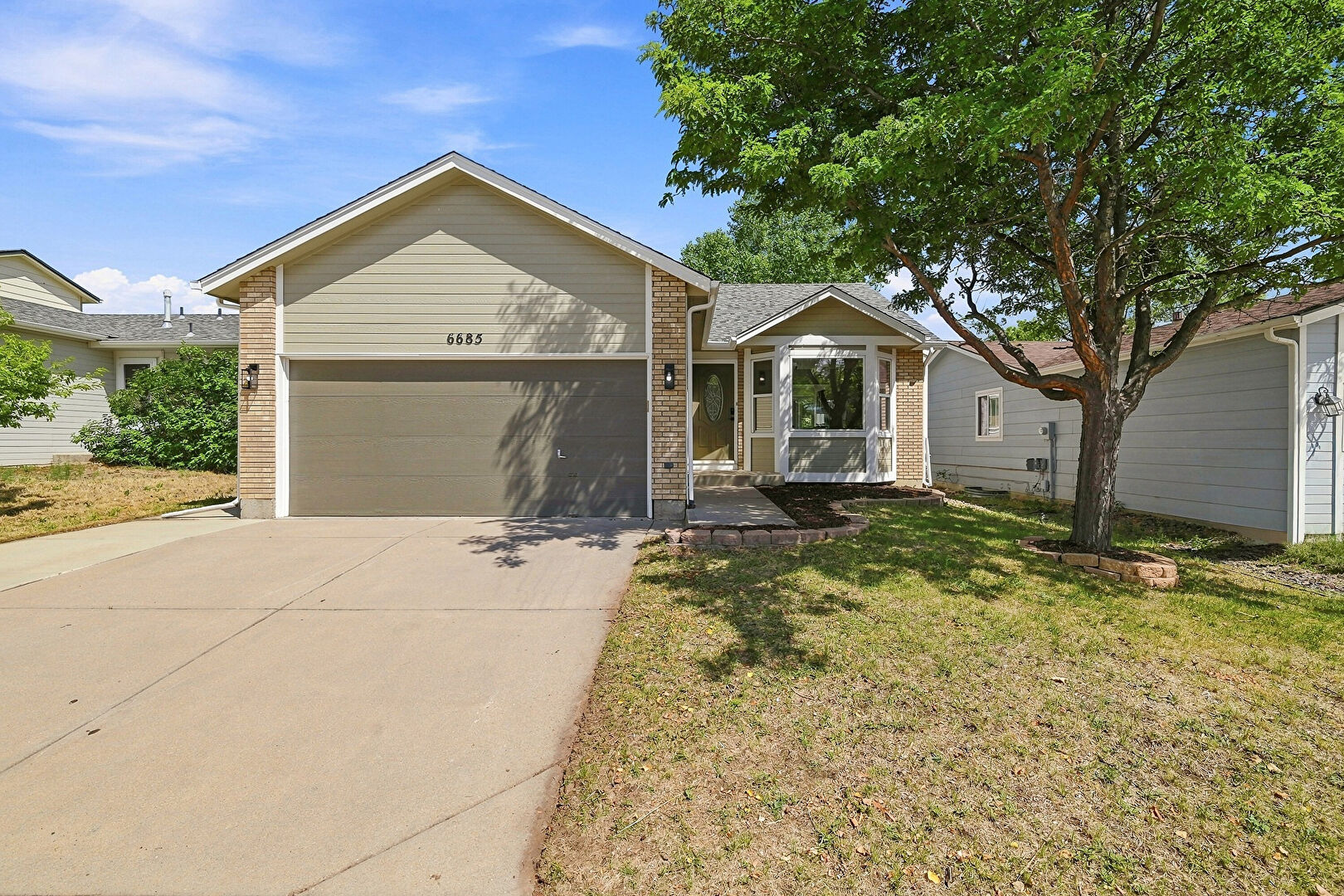 Front at 6685 Bear Tooth Drive, Colorado Springs, CO 80923, listed by Amanda Moss