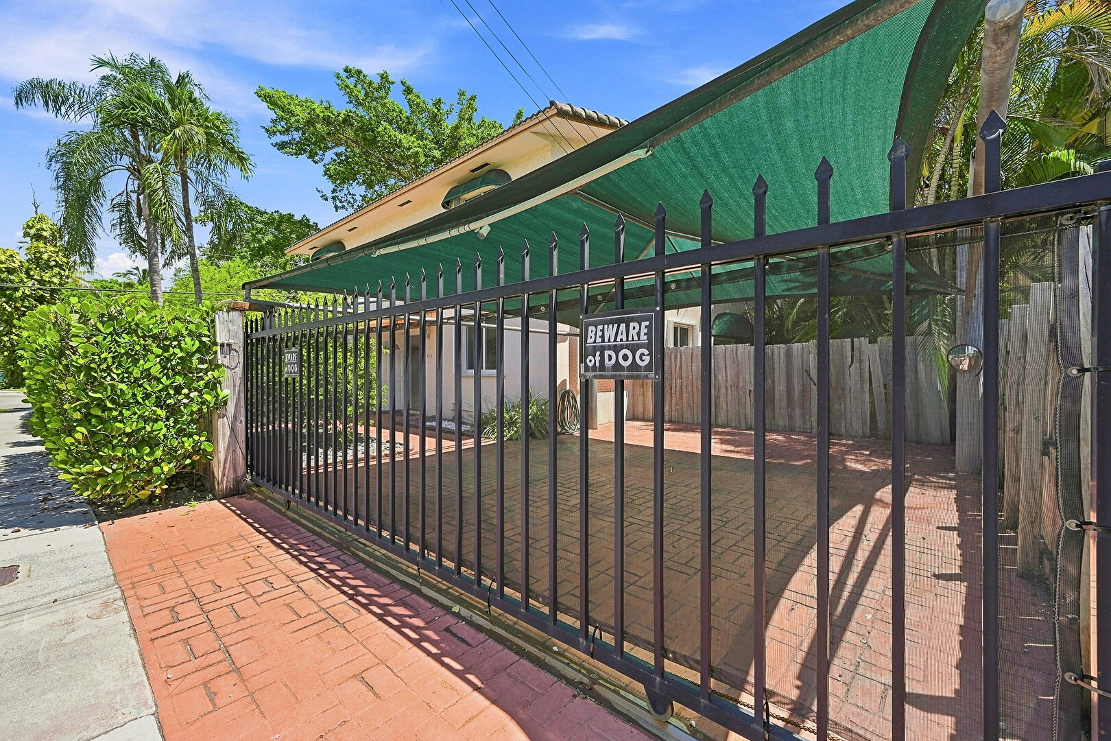 Gate at 3203 McDonald Street, Miami, FL 33133, listed by Chris Toomey