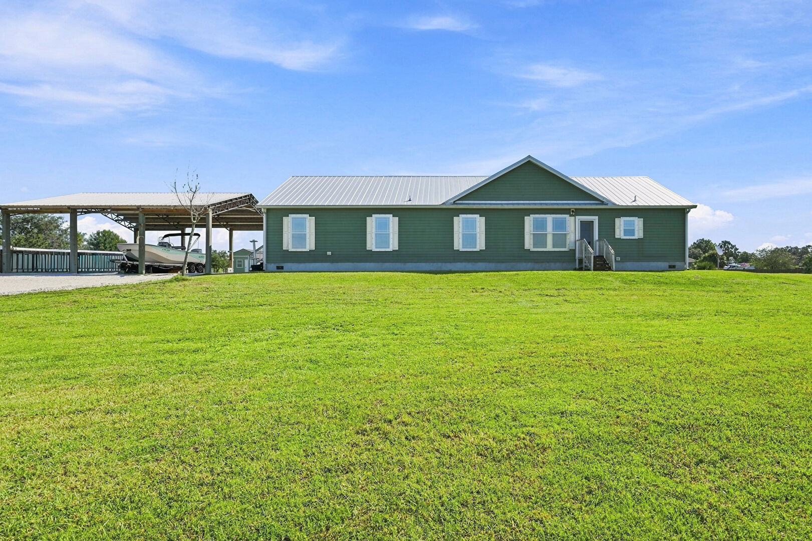 Front at 4944 Northeast 115th Place, Okeechobee, FL 34972, listed by Jason M Coley