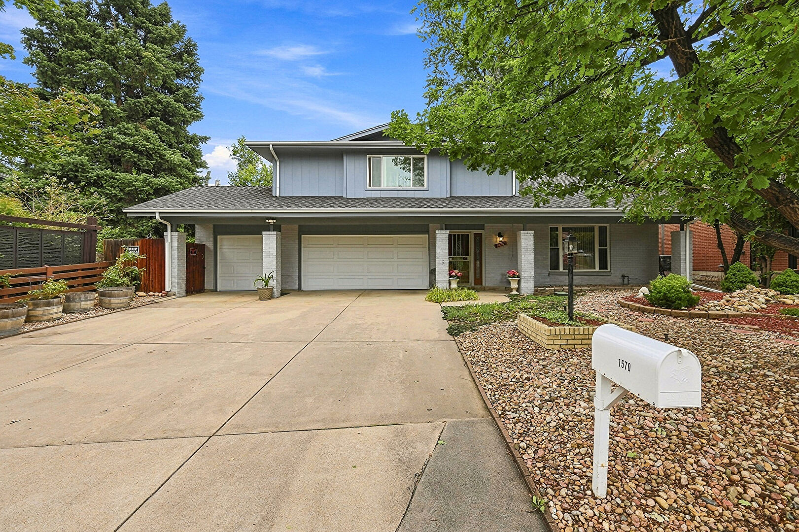 Front at 1570 South Macon Street, Aurora, CO 80012, listed by Mike & Ed Hardey