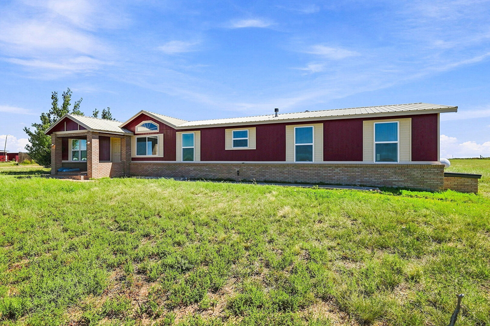 Front at 1497 County Road S, Rush, CO 80833, listed by Carlos Hernandez Guizar