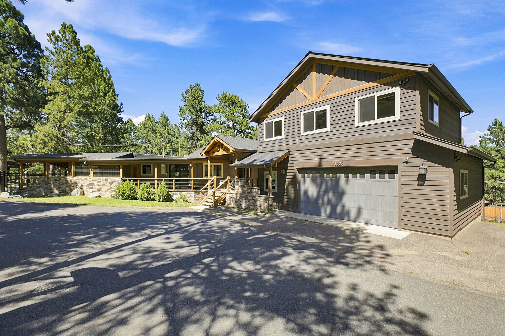 Front at 28609 Pine Drive, Evergreen, CO 80439, listed by Pandora & John Erlandson, MLS ID: 9053379
