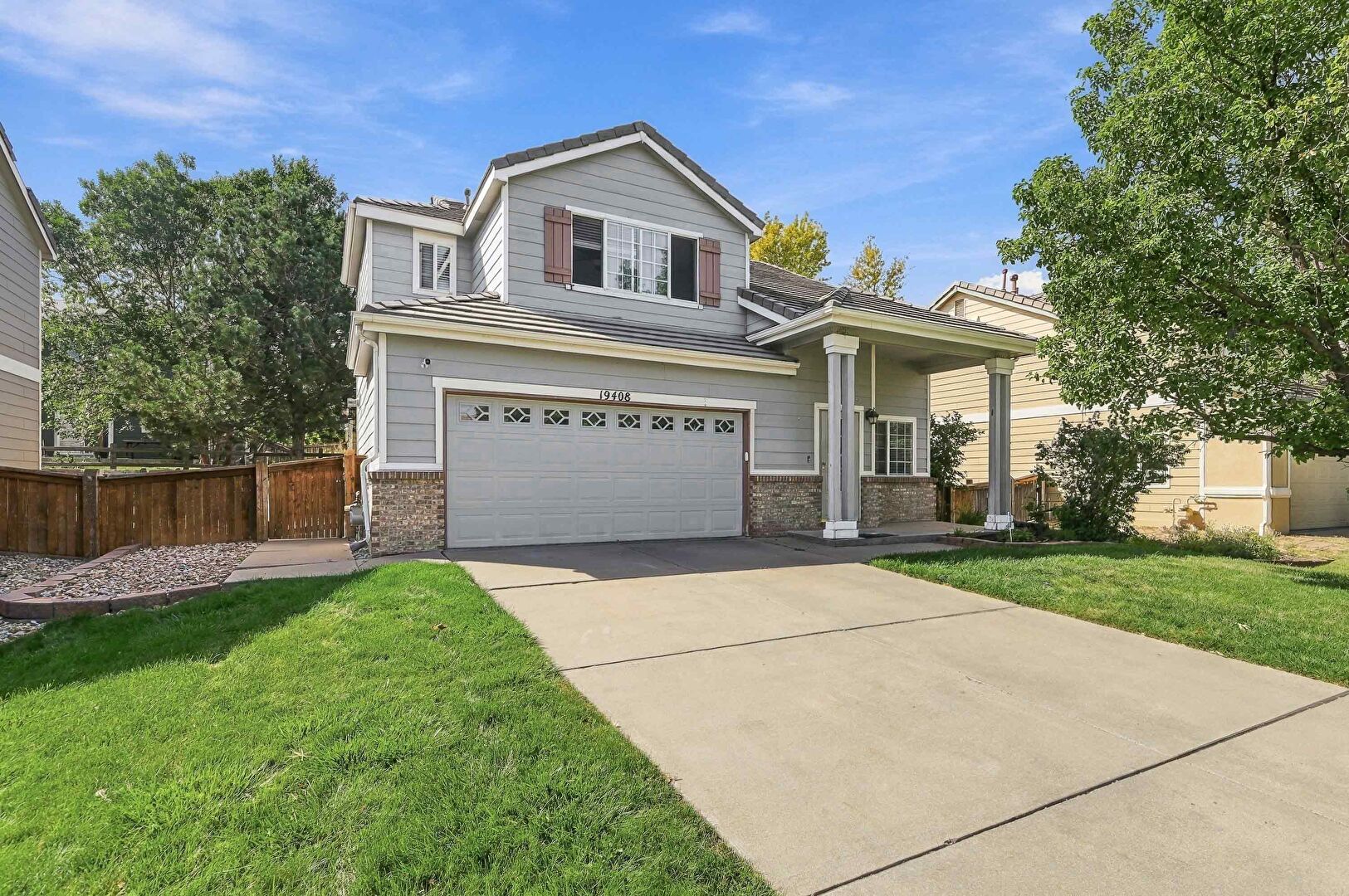 Front at 19408 East 59th Avenue, Aurora, CO 80019, listed by Chris Baltazar