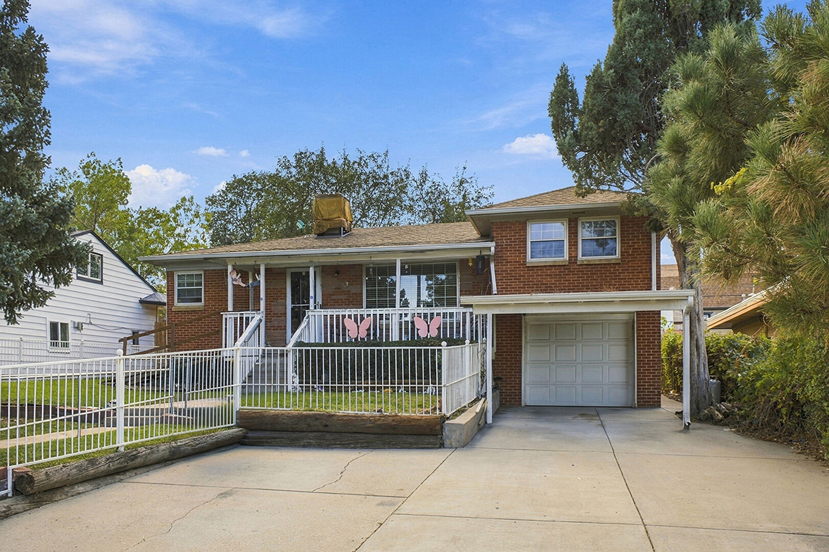 Front at 6841 Irving Street, Denver, CO 80221, listed by Luz Daniels
