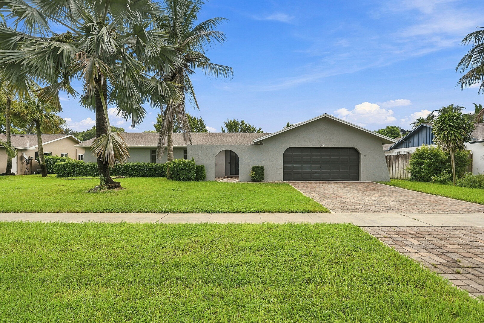 Front at 12758 Guilford Circle, Wellington, FL 33414, listed by Ravi Mohanka