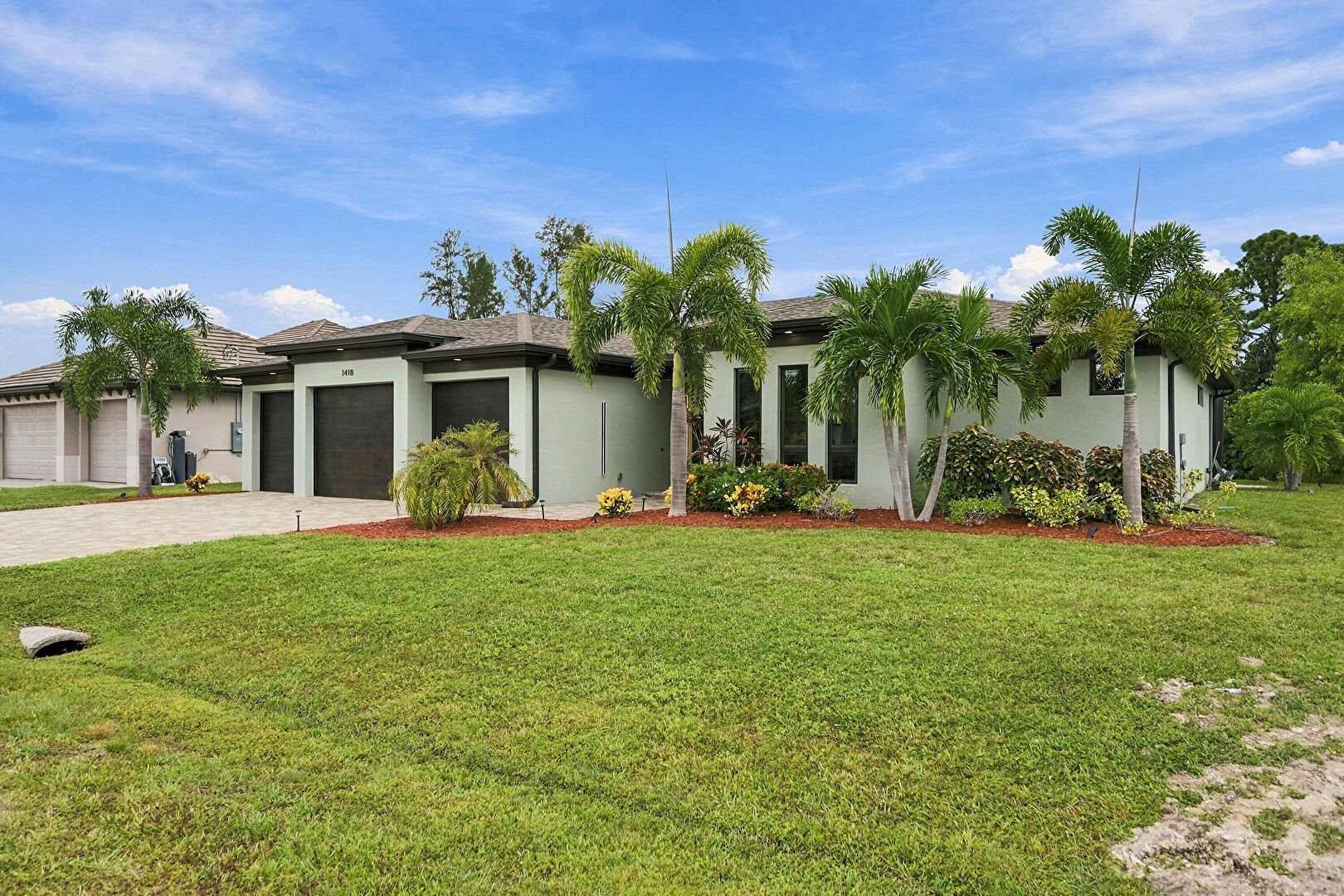 Front at 1418 Southwest 1st Place, Cape Coral, FL 33991, listed by Emma Ignacio