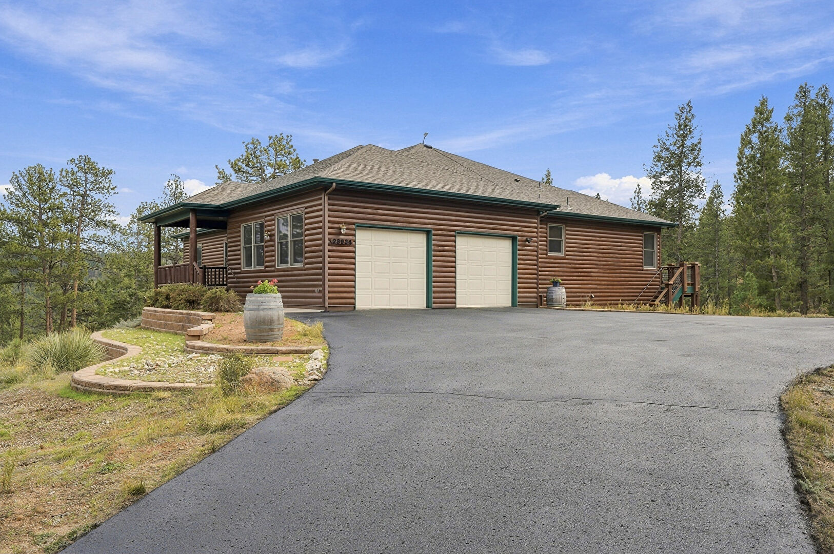 Front at 28934 Amerind Springs Trail, Pine, CO 80470, listed by K.C. Golfinopoulos