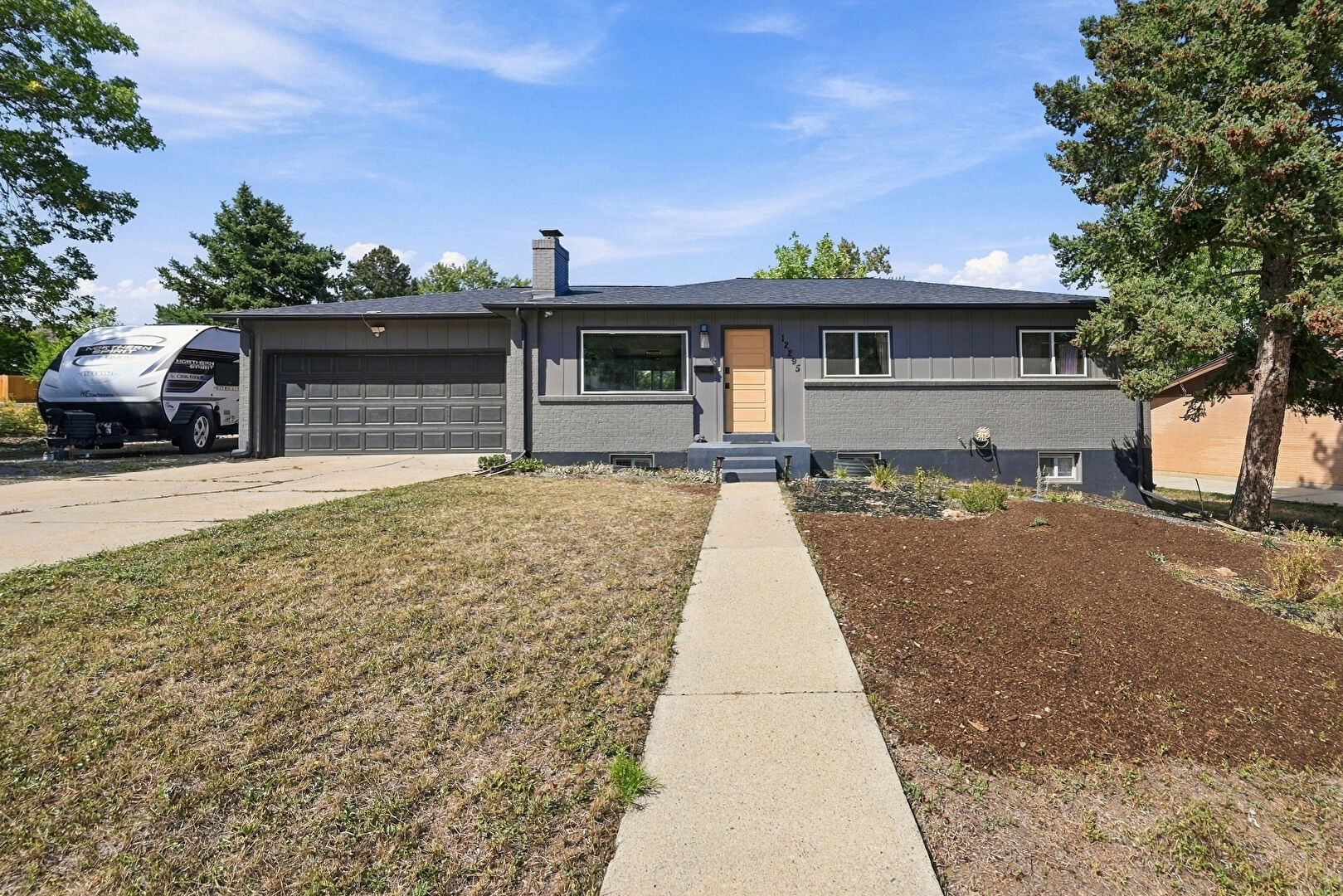 Exterior Entry at 12295 West Ohio Place, Lakewood, CO 80228, listed by Kelly Camacho
