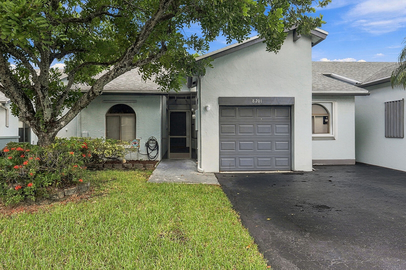 Front at 8201 Northwest 100th Lane, Tamarac, FL 33321, listed by Mike DeRosa