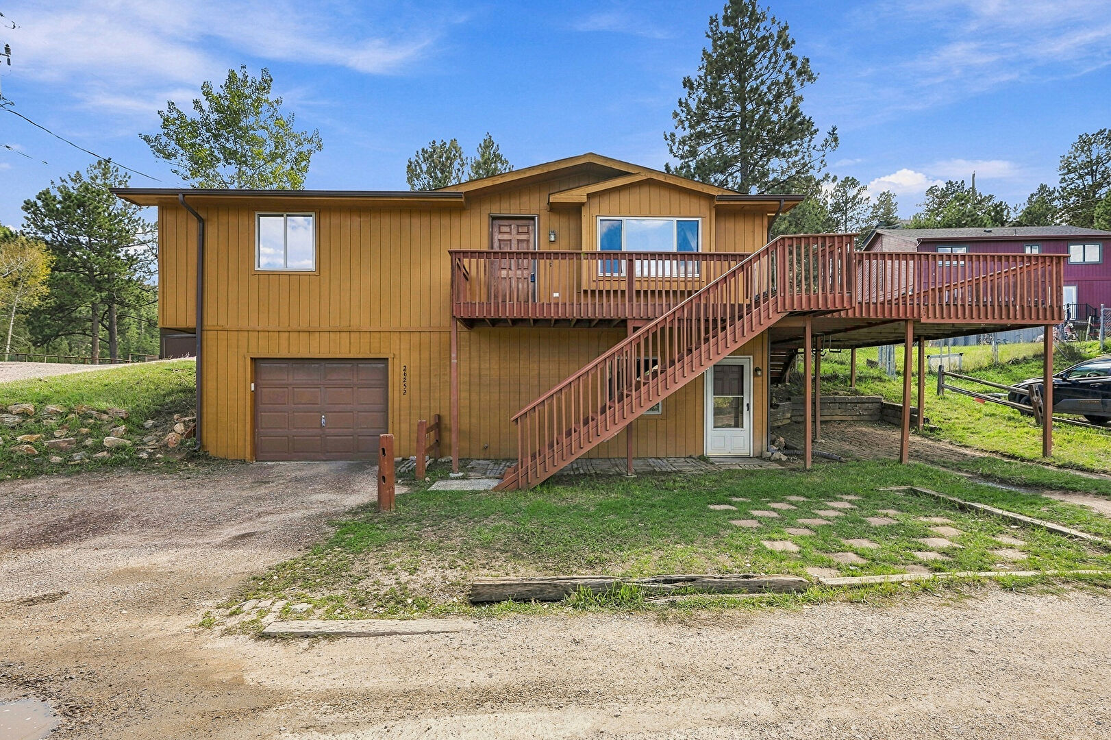 Front at 26252 Abert Lane, Kittredge, CO 80457, listed by Kimberly Burns