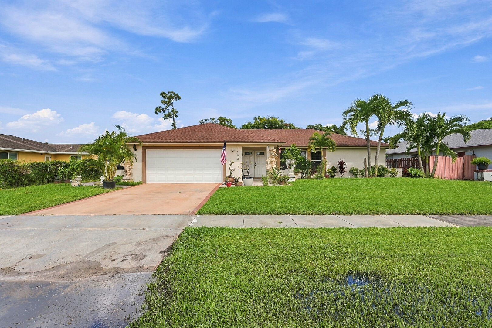 Front at 1402 The 12th Fairway, Wellington, FL 33414, listed by Ryan Jennings