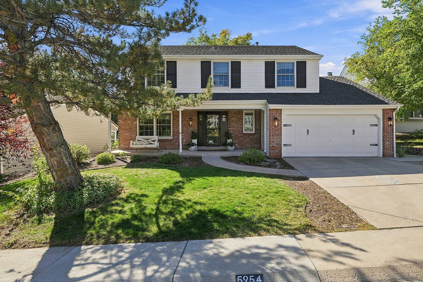 Front at 5954 East Irwin Place, Centennial, CO 80112, listed by Eric Johnson