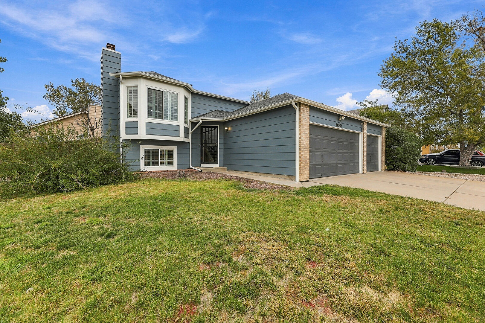 Front at 20597 East 42nd Avenue, Denver, CO 80249, listed by Taylor Haas