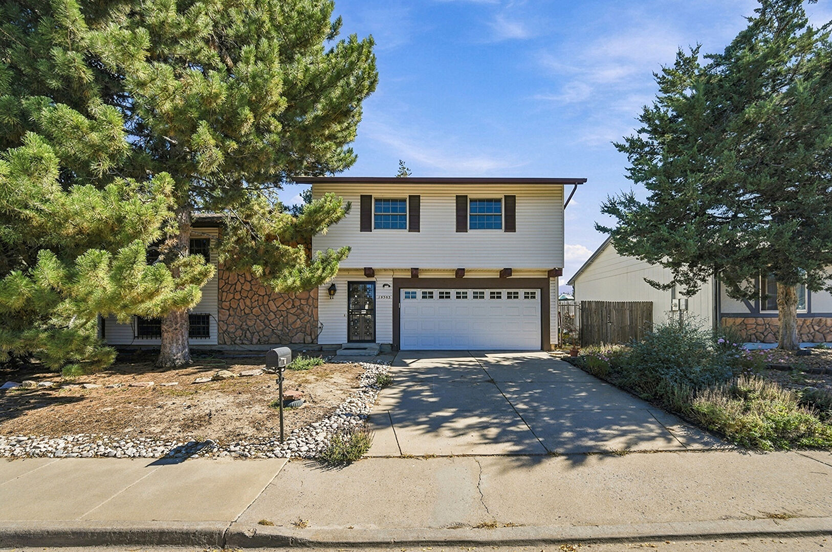 Front at 15303 East Nassau Drive, Aurora, CO 80013, listed by Brad Inhulsen