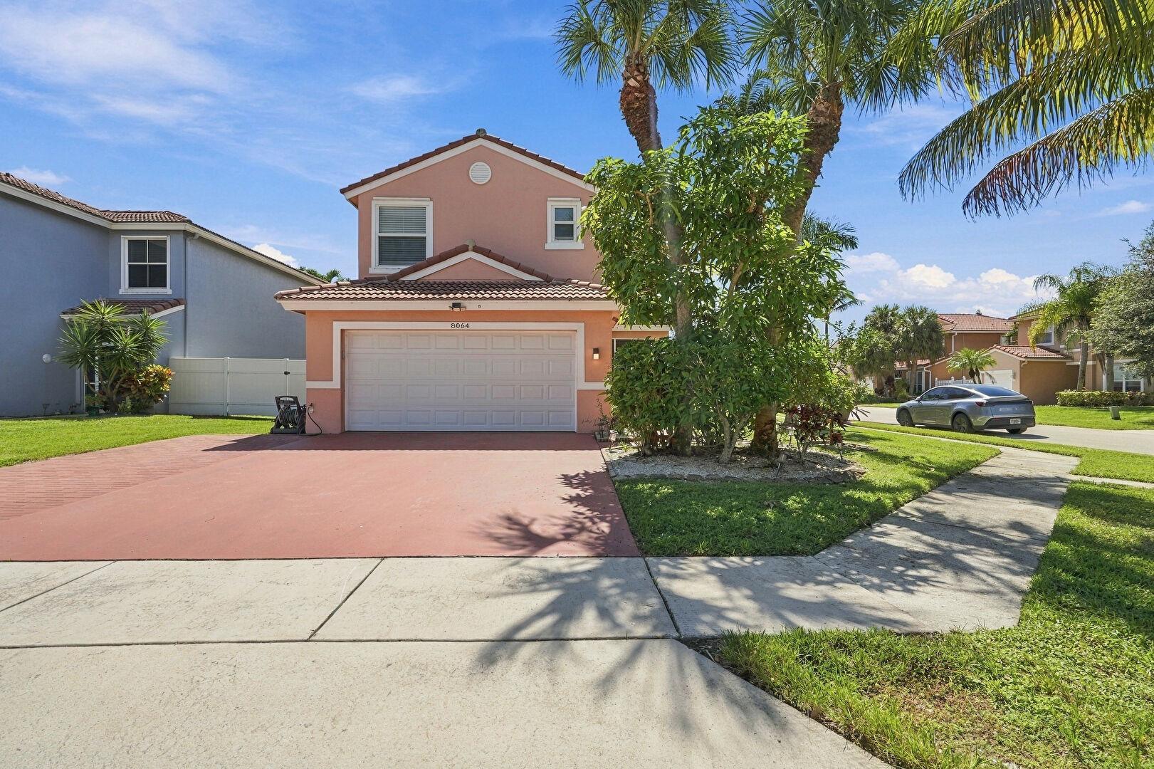 Front at 8064 Pelican Harbour Drive, Greenacres, FL 33467, listed by Keith Weiner