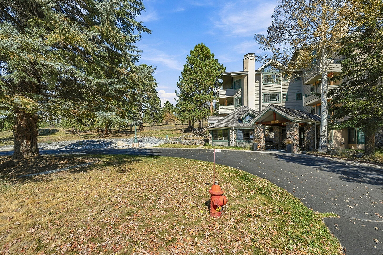 Front at 31819 Rocky Village Drive, Evergreen, CO 80439, listed by Pandora & John Erlandson