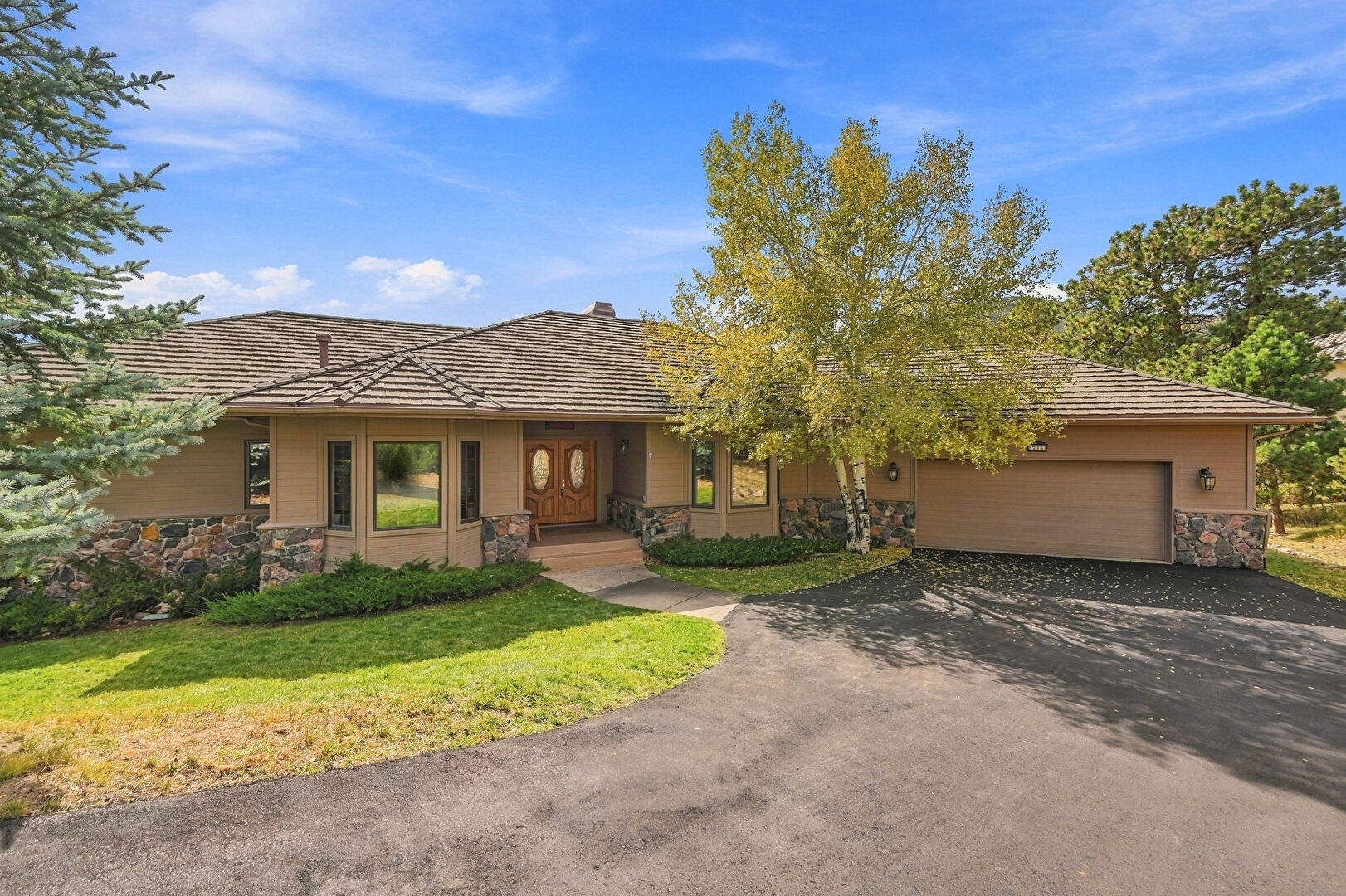 Front at 32650 El Diente Court, Evergreen, CO 80439, listed by Pandora & John Erlandson