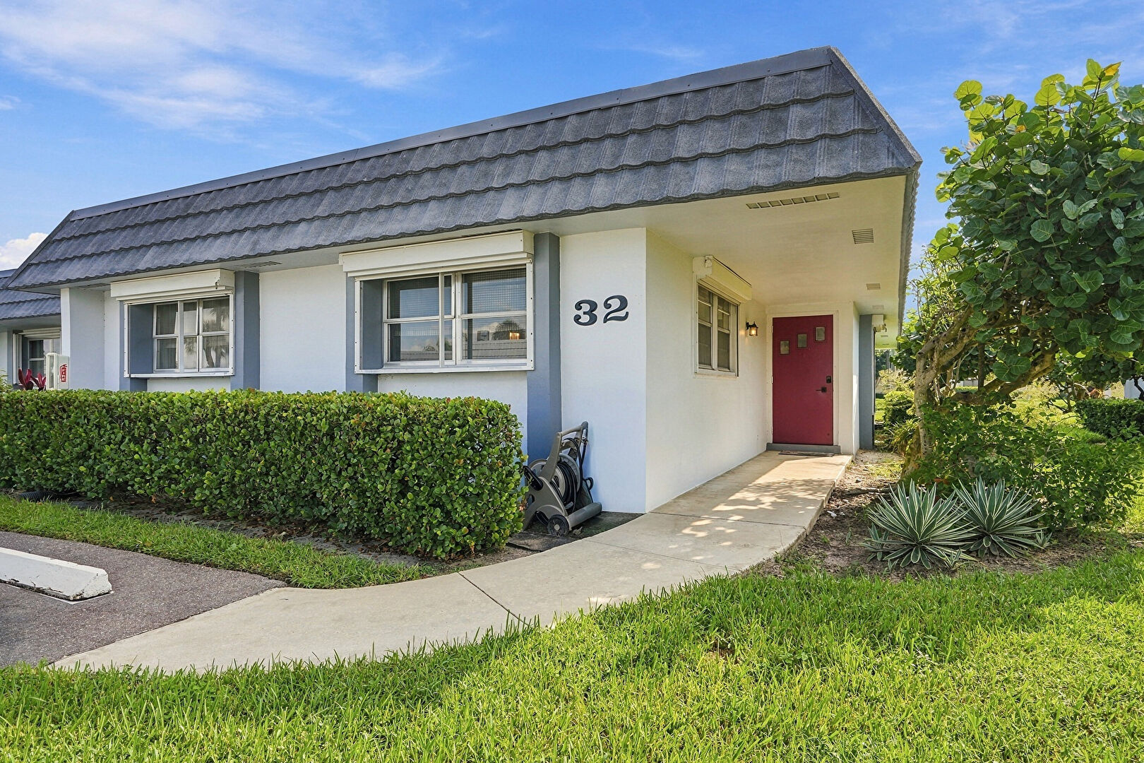 Front at 2886 Fernley Drive East, West Palm Beach, FL 33415, listed by Larry Mastropieri