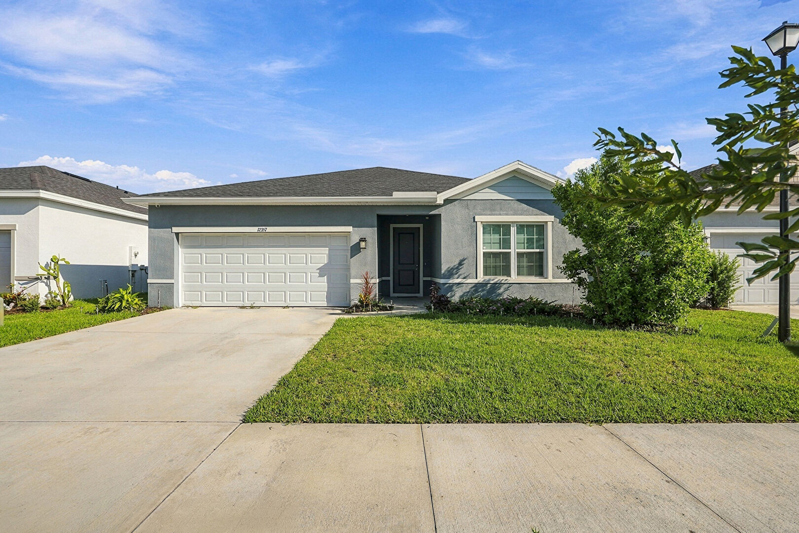 Exterior Entry at 12357 SW Forli Way, Port St Lucie, FL 34987, listed by Jacob (Jake) Newman, MLS ID: B26085612