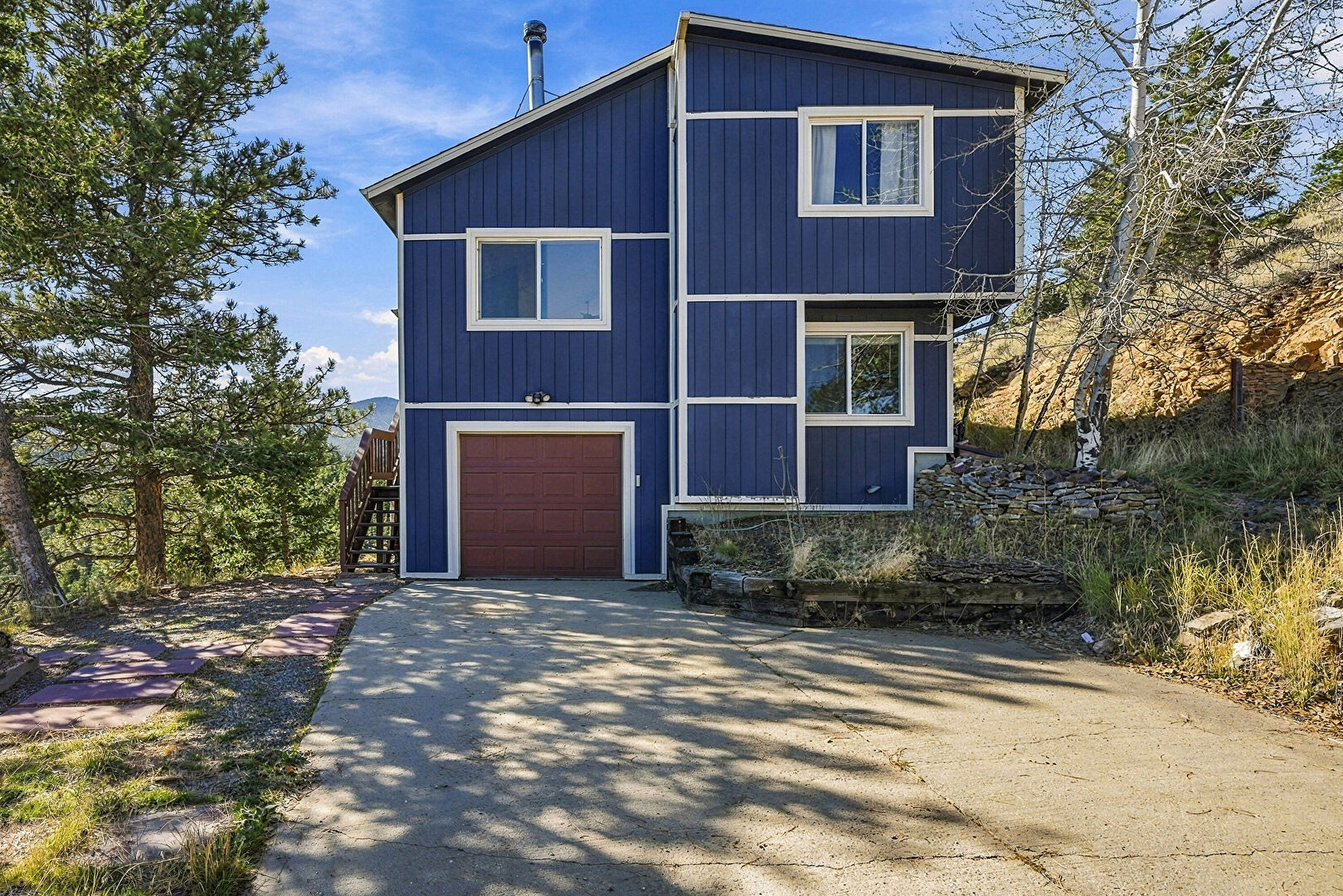 Front at 1243 Hyland Dr, Evergreen, CO 80439, listed by Kimberly Burns