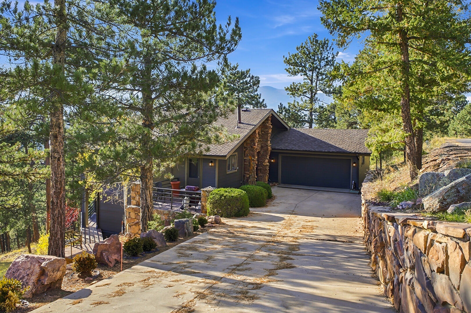 Front at 3877 Ridge Road, Evergreen, CO 80439, listed by K.C. Golfinopoulos